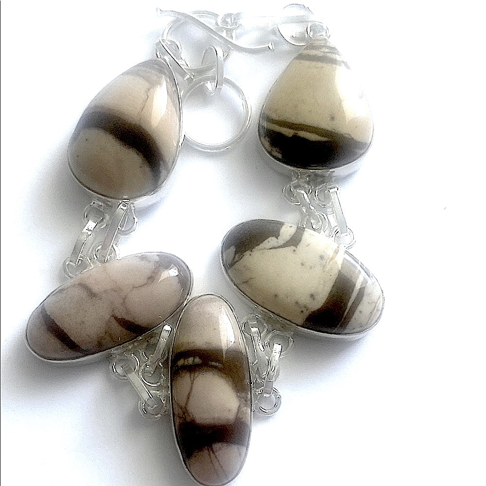 Beautiful 5 stone, 925 marked, Coconut Jasper bracelet size 8- 8 1/2